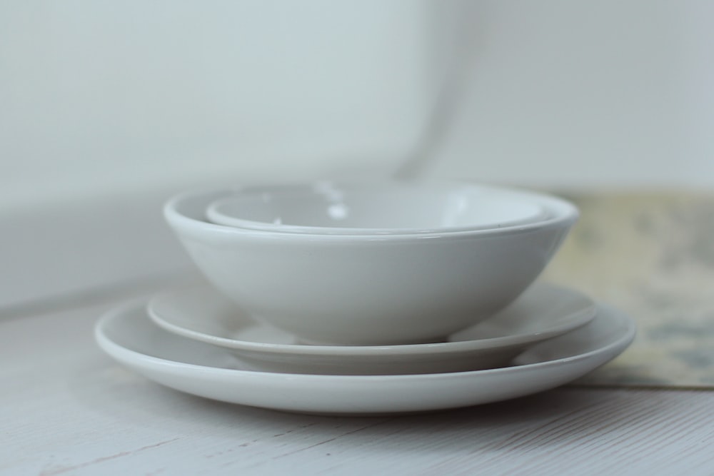 white ceramic bowl on white table