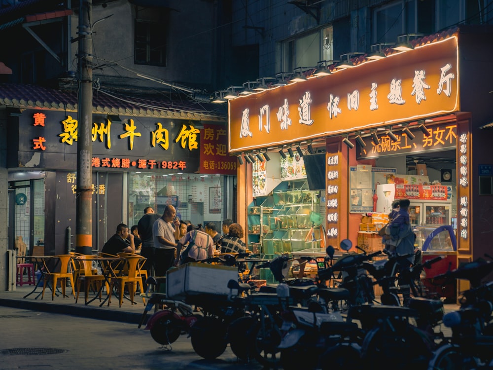 people sitting on chair near store during daytime