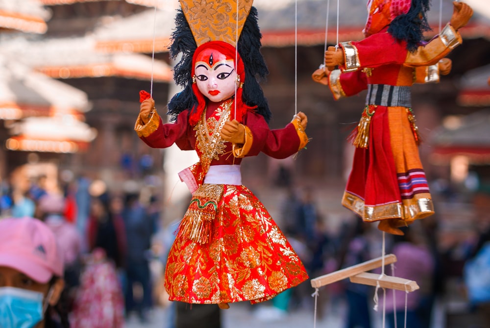 person in red and yellow traditional dress