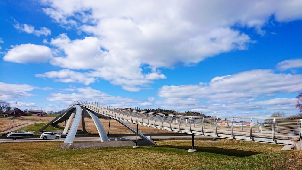 white metal bridge under blue sky during daytime