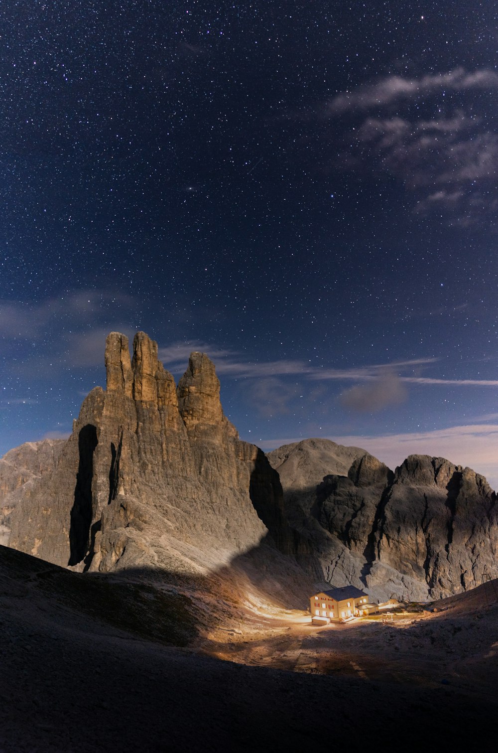 brown rocky mountain under blue sky during night time