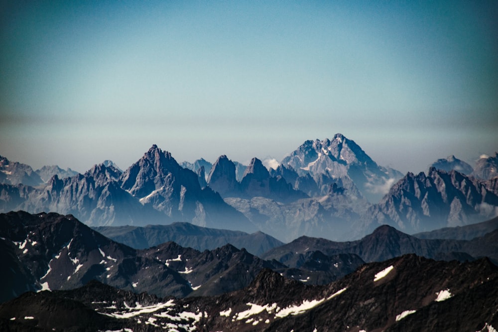 snow covered mountain under blue sky during daytime