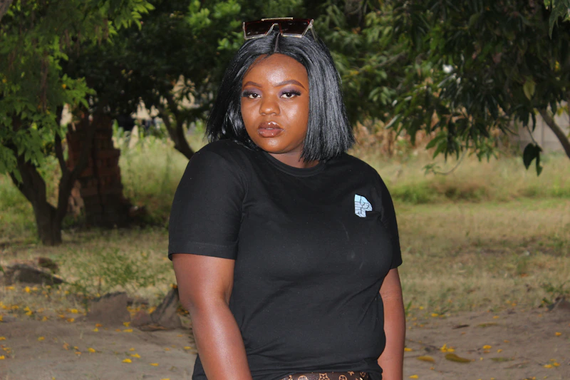 BBW woman in black crew neck t-shirt on a dirt road