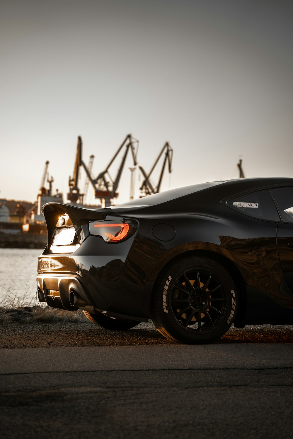 black and white sports car on brown sand during daytime