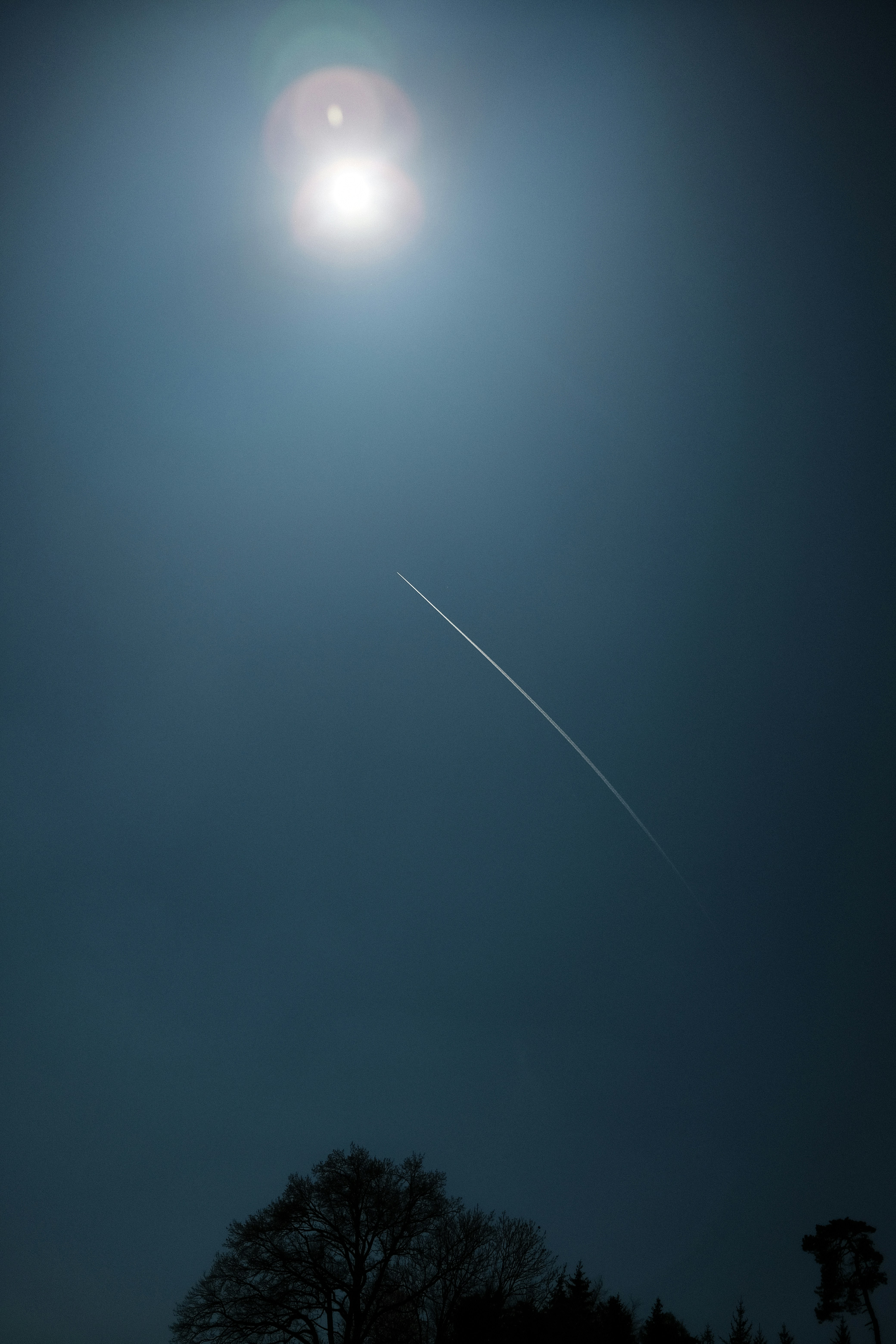 white light bulb turned on during night time