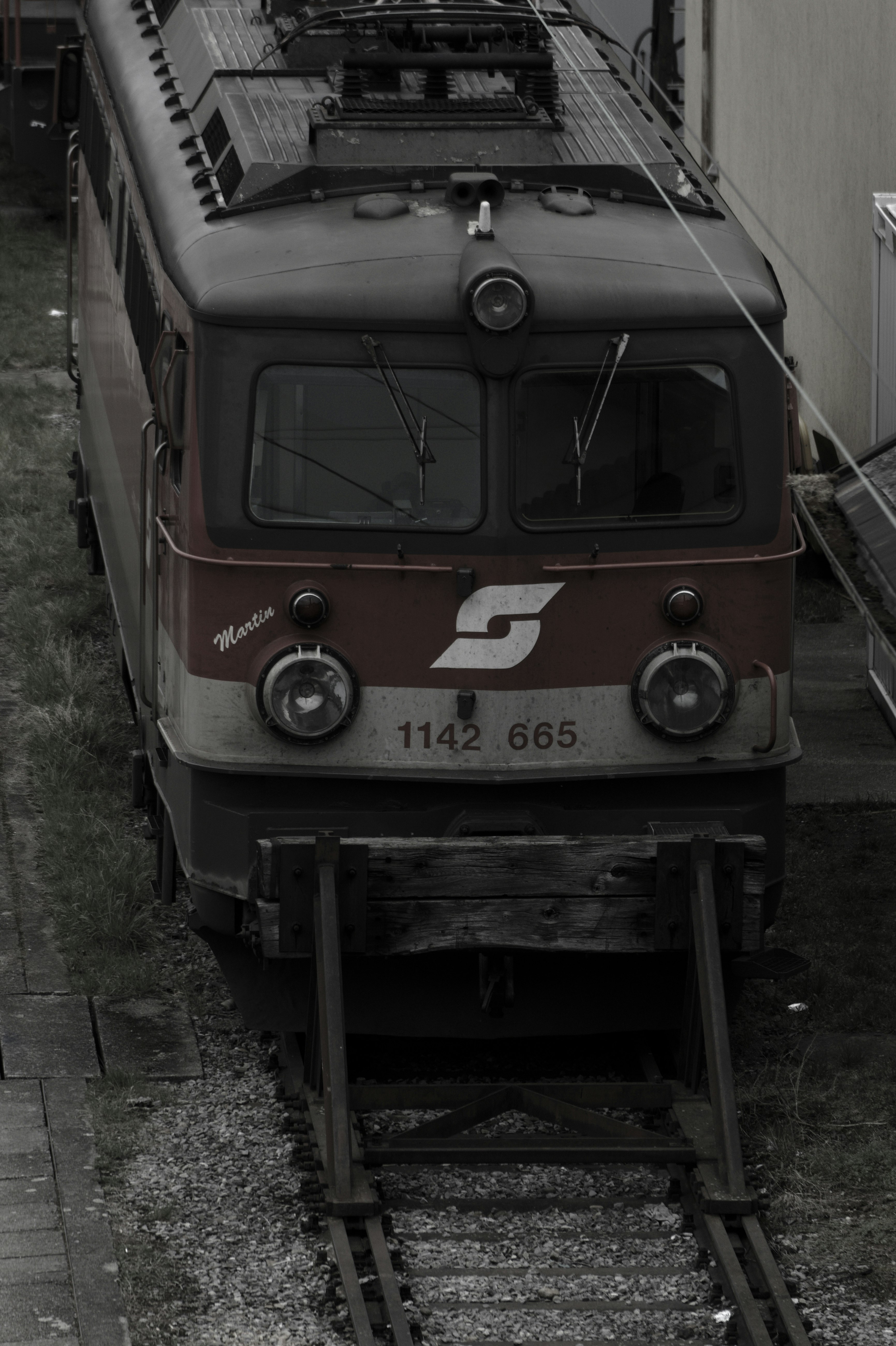 white and brown train on rail tracks during daytime