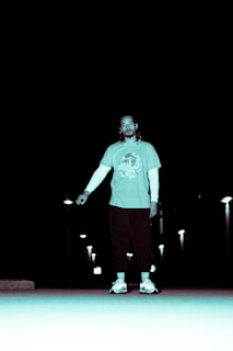 A nighttime cityscape with a person wearing Lumina Apparel gear blending into the urban vibe.