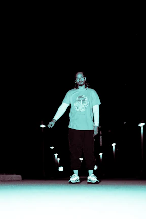 Model wearing Lumina Apparel urban outfit walking through city streets at dusk.