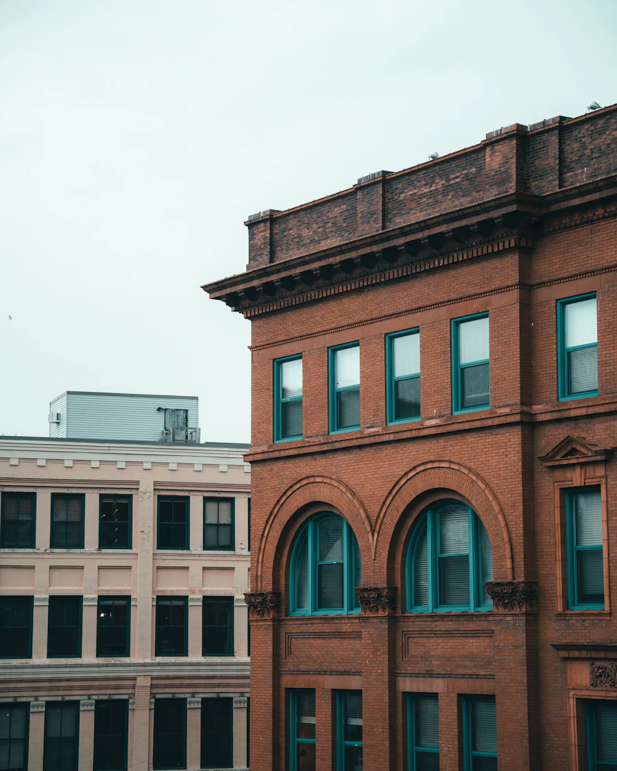 An old red brick commercial building with arched windows