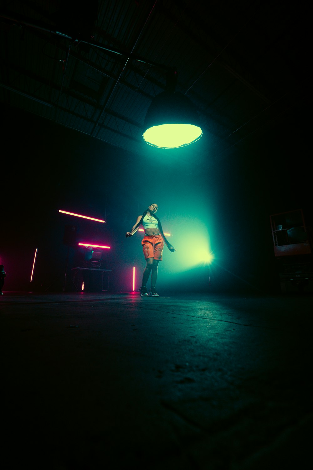 man in black shirt playing guitar on stage