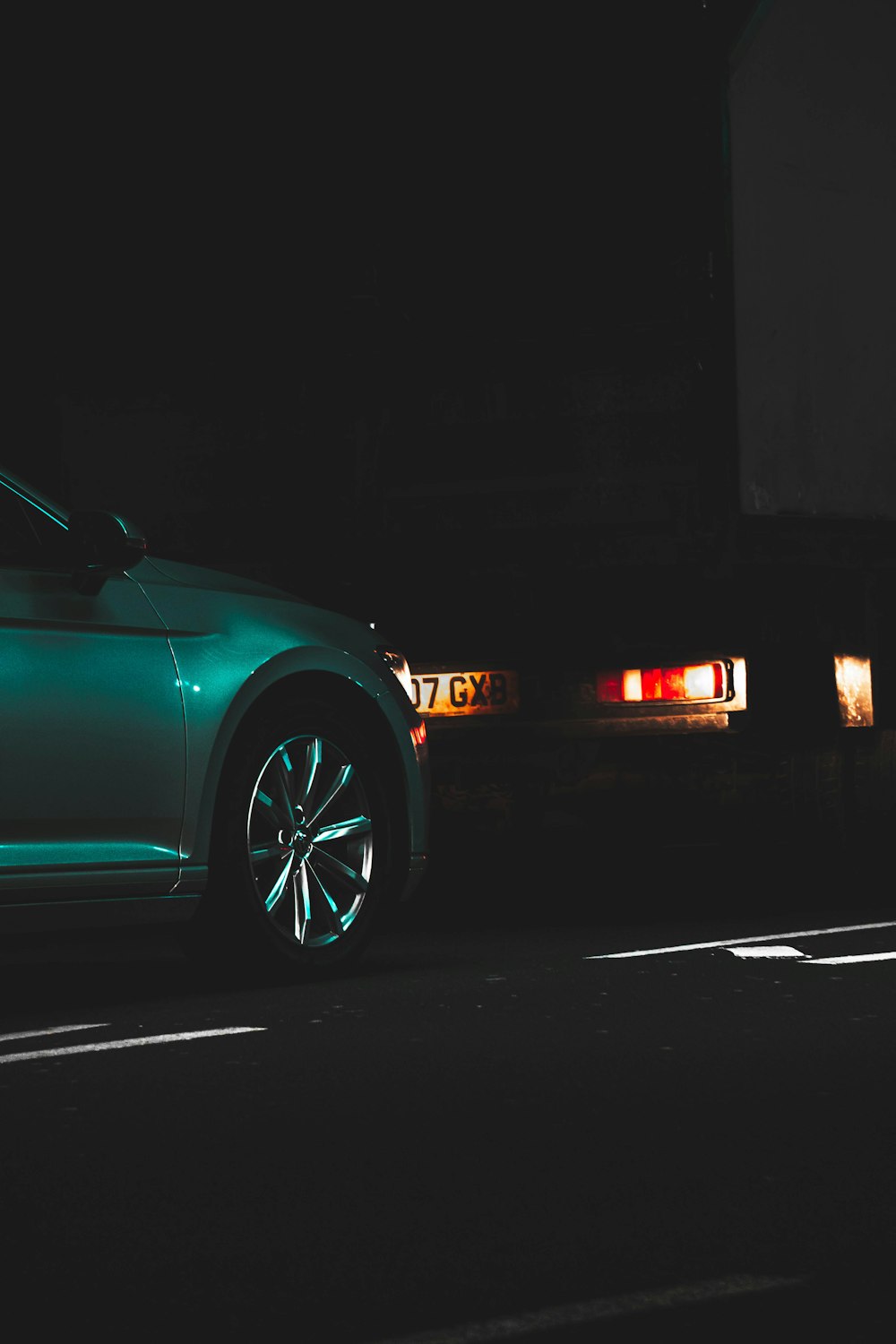 blue car parked on a parking lot