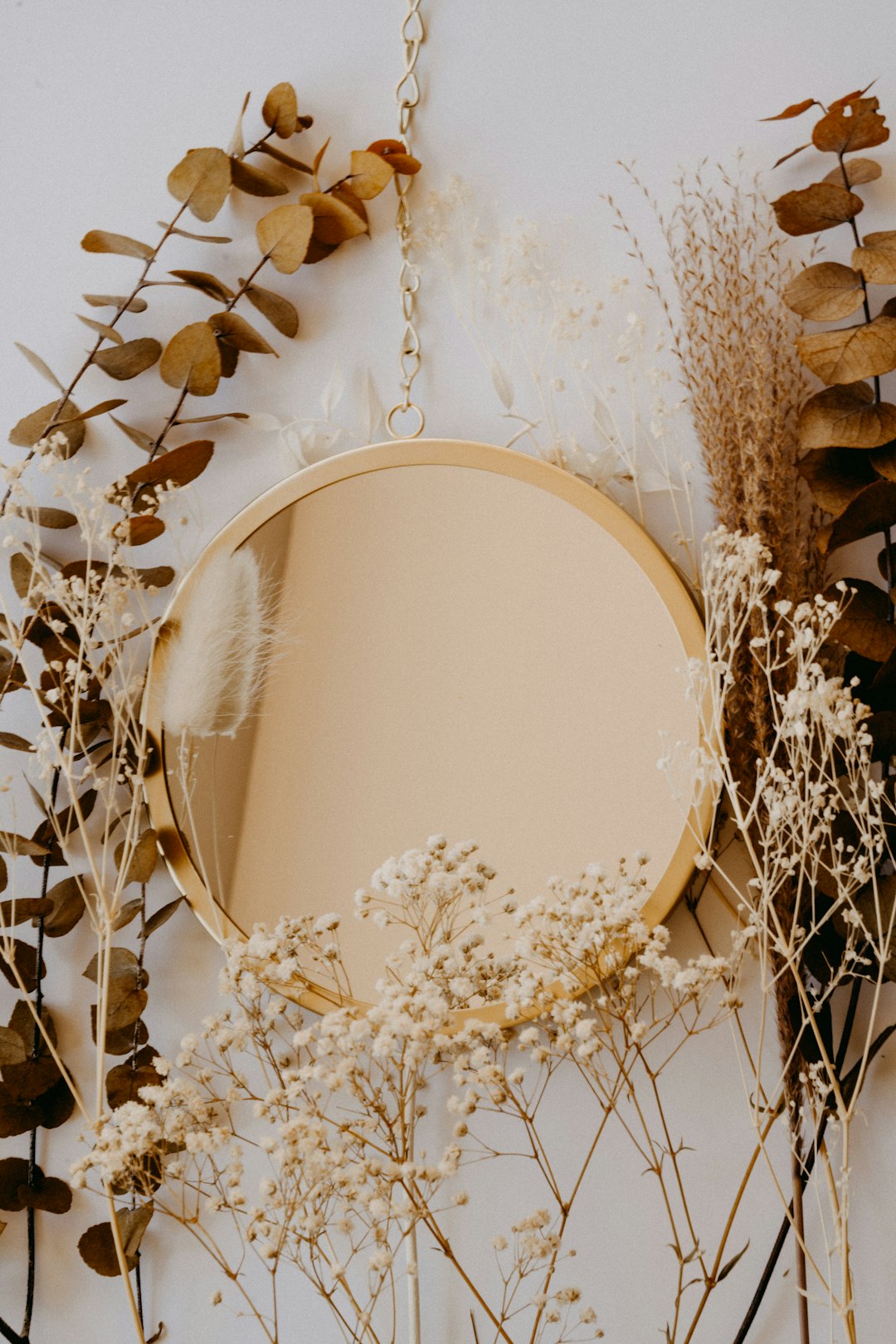  brown and white round mirror mirror