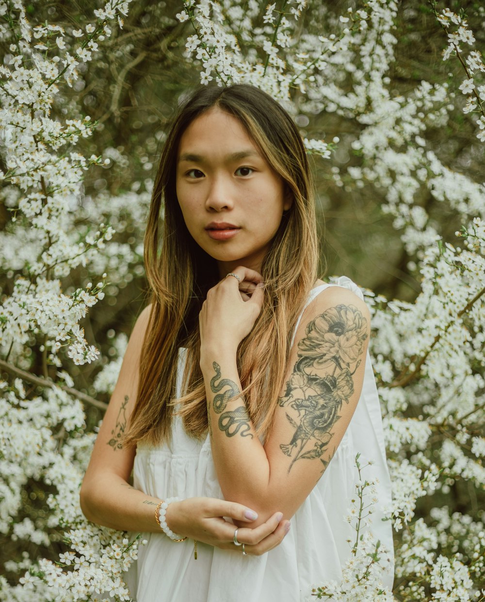 woman in white and brown floral dress