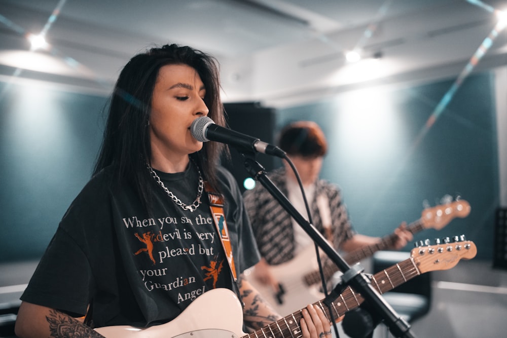 woman in black long sleeve shirt singing