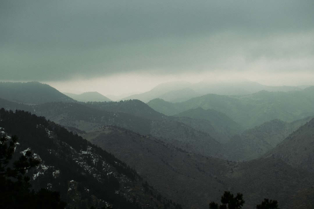 green mountains under white clouds during daytime
