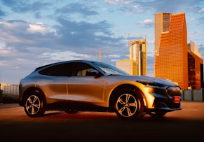 silver bmw m 3 coupe parked near city buildings during daytime