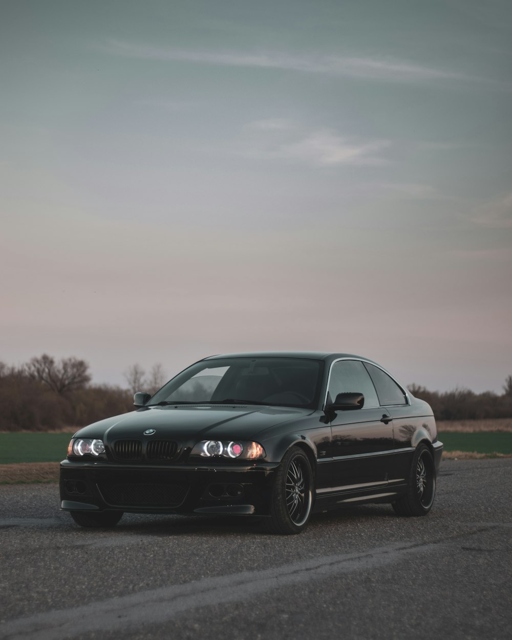 black mercedes benz coupe on road during daytime