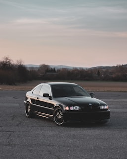 black mercedes benz coupe on road during daytime