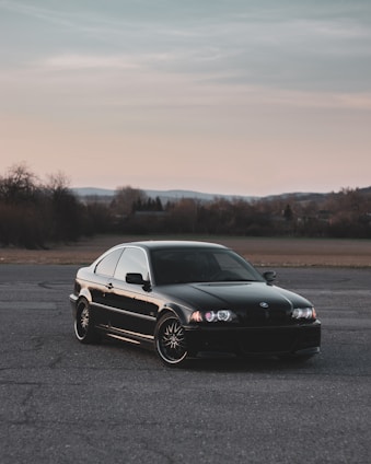 black mercedes benz coupe on road during daytime
