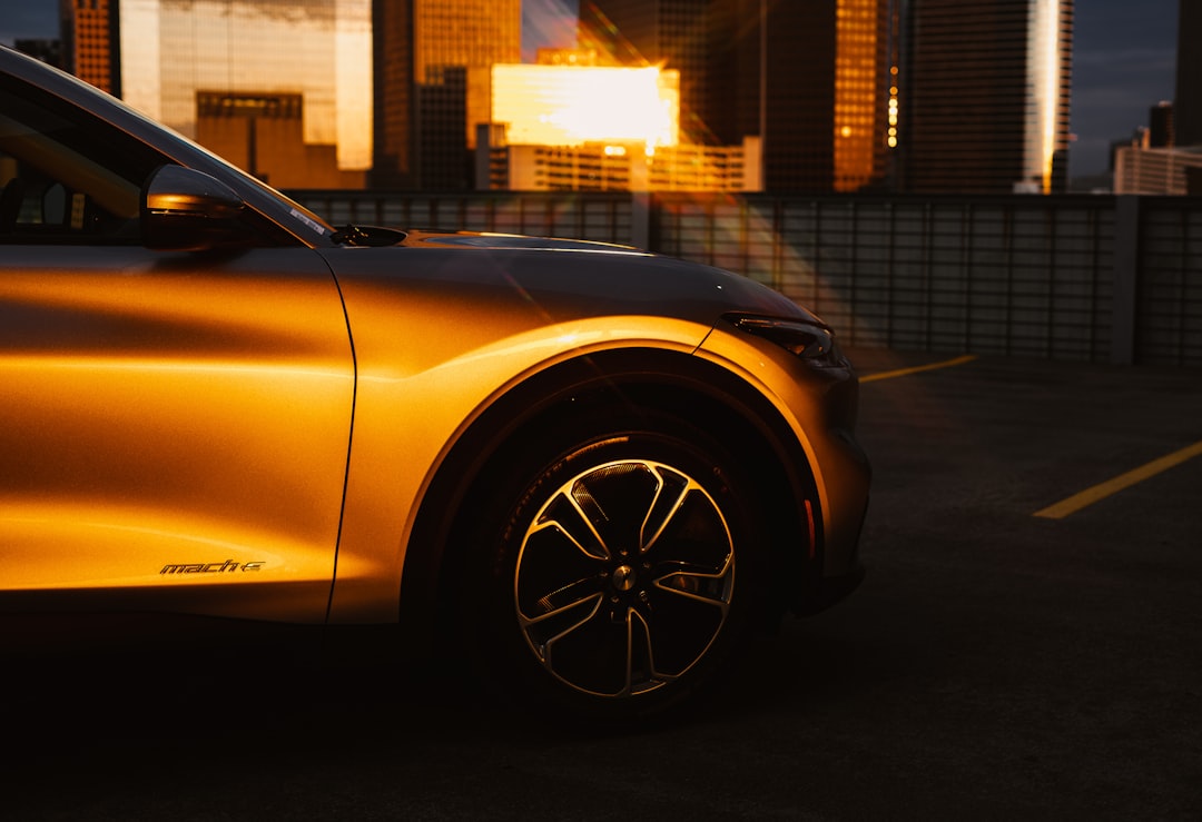 yellow car in front of building