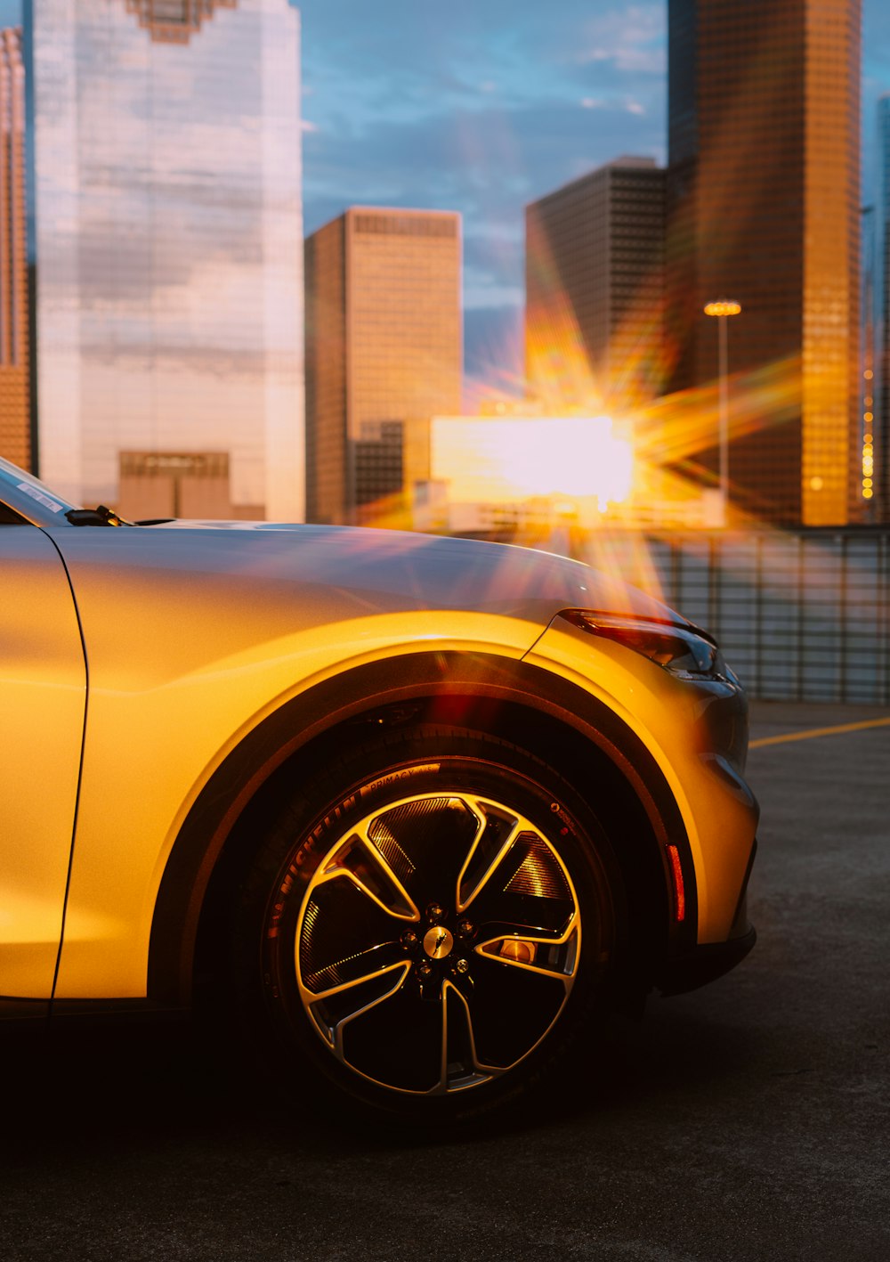 yellow car in front of building during daytime