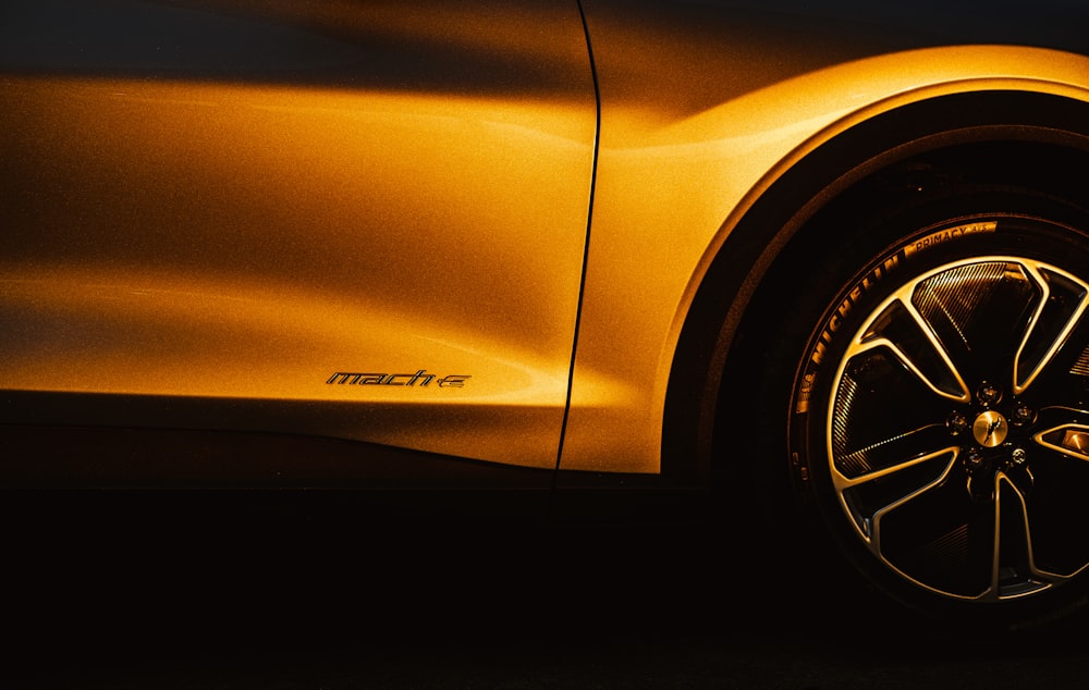 yellow car with black and white wheel