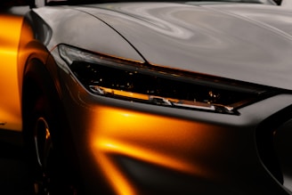 orange car in close up photography