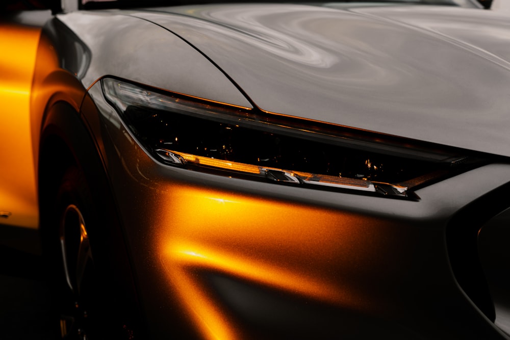 orange car in close up photography
