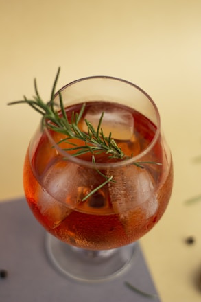 clear drinking glass with red liquid