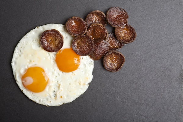 Fried egg on white ceramic plate