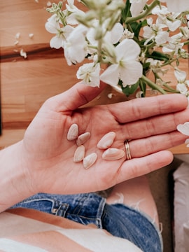 white flowers on persons hand