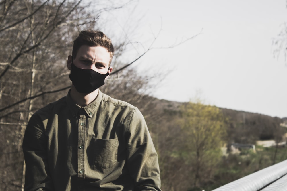 man in black sunglasses and gray jacket