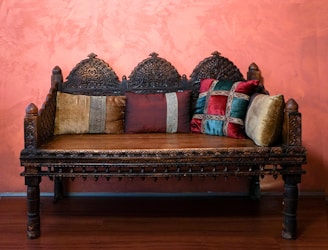 brown wooden framed brown and red floral padded couch