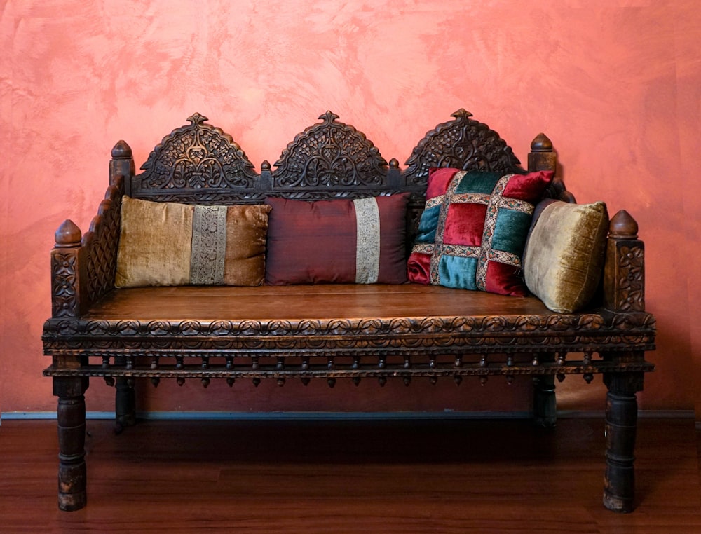 brown wooden framed brown and red floral padded couch