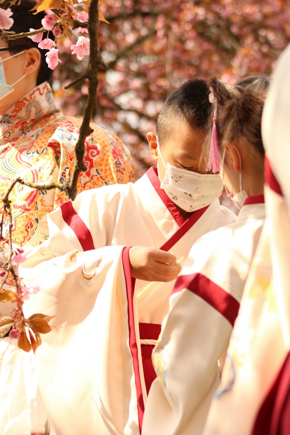 man in white dress shirt with red and white scarf