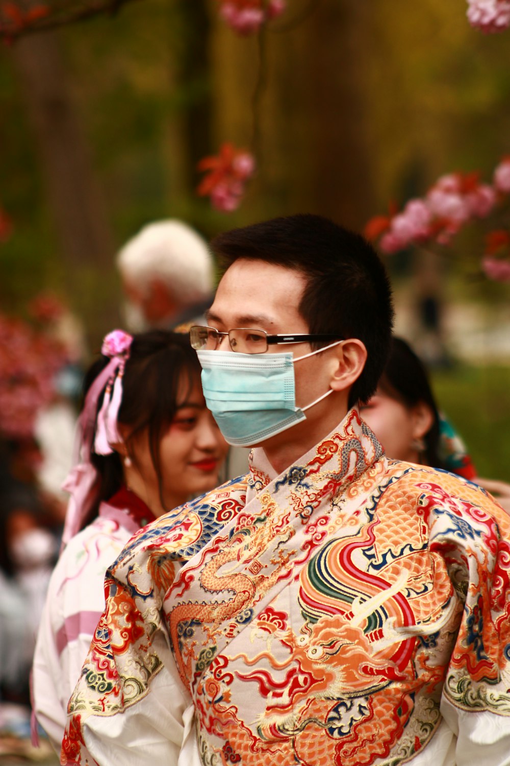 woman in white green and red floral shirt