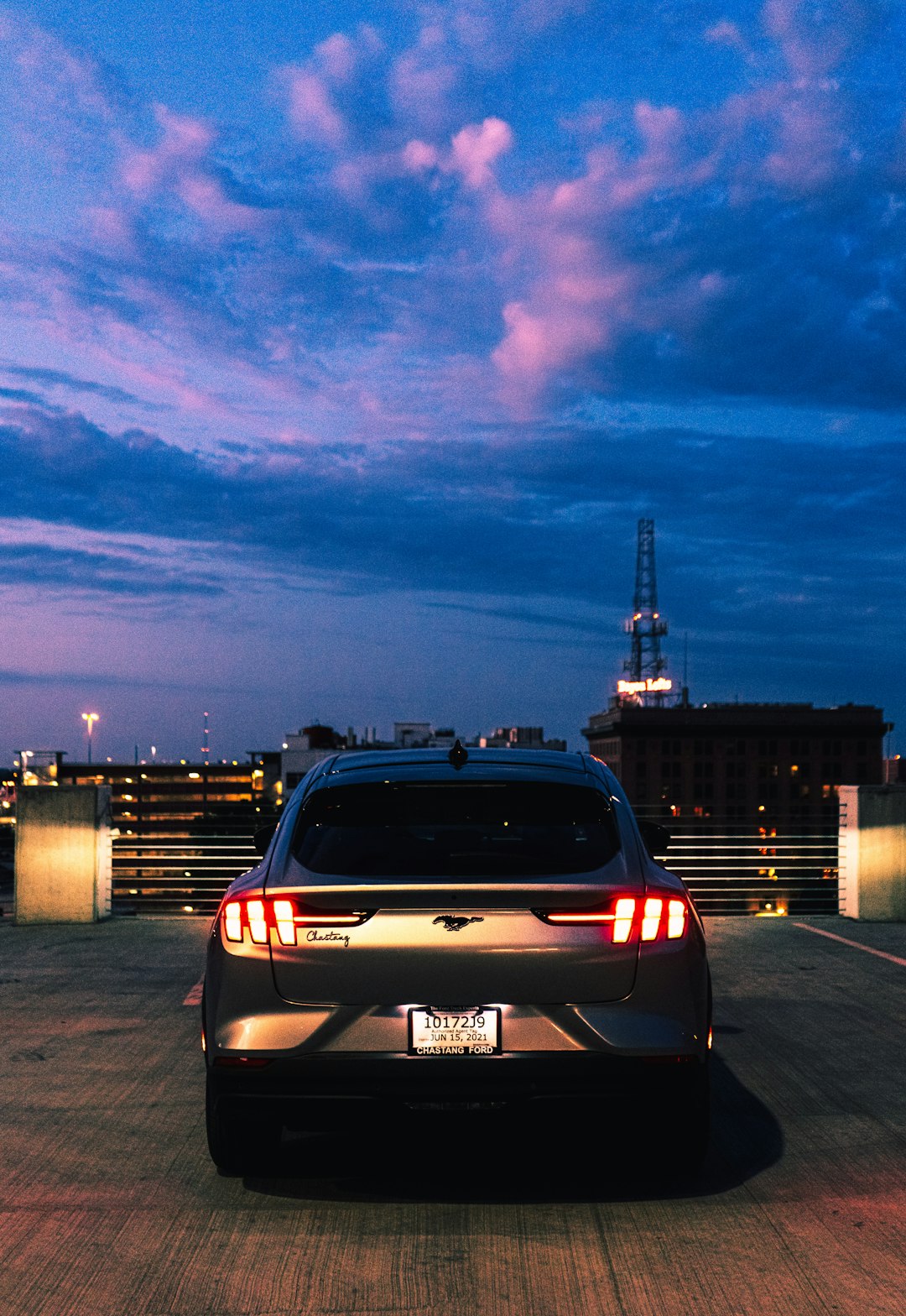 black car on road during night time