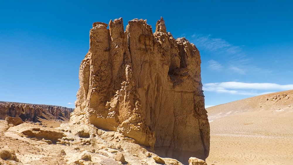 brown rock formation under blue sky during daytime