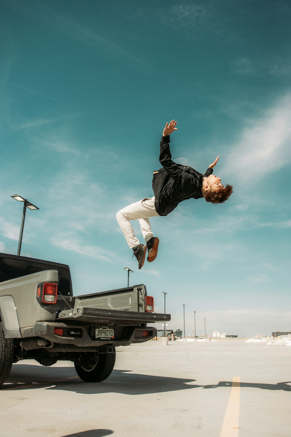 man in black t-shirt jumping on the air