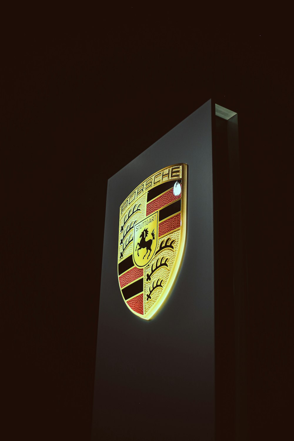 a close up of a porsche emblem on a building