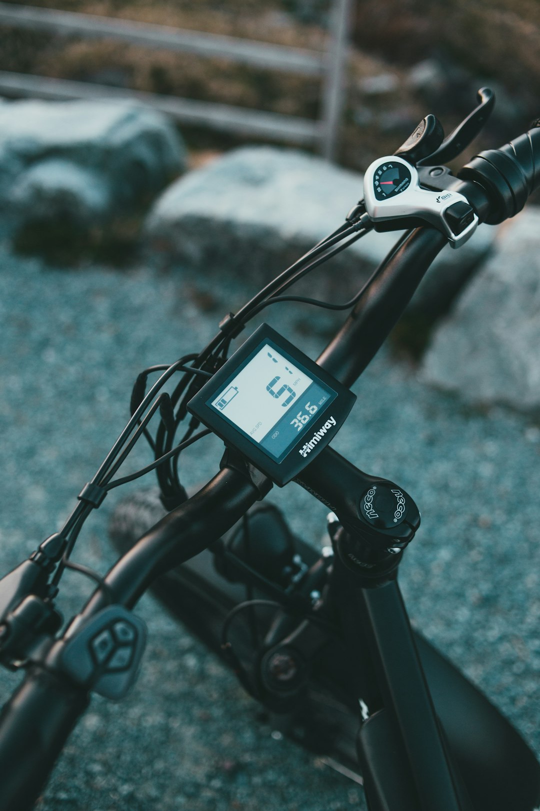 black and gray bicycle with black and white digital device