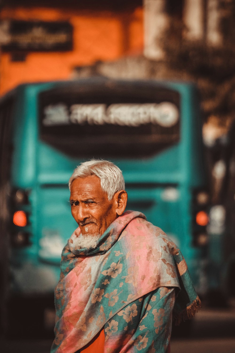 man in green and brown camouflage shirt