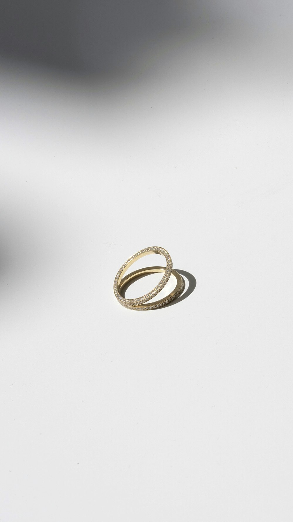 gold ring on white surface