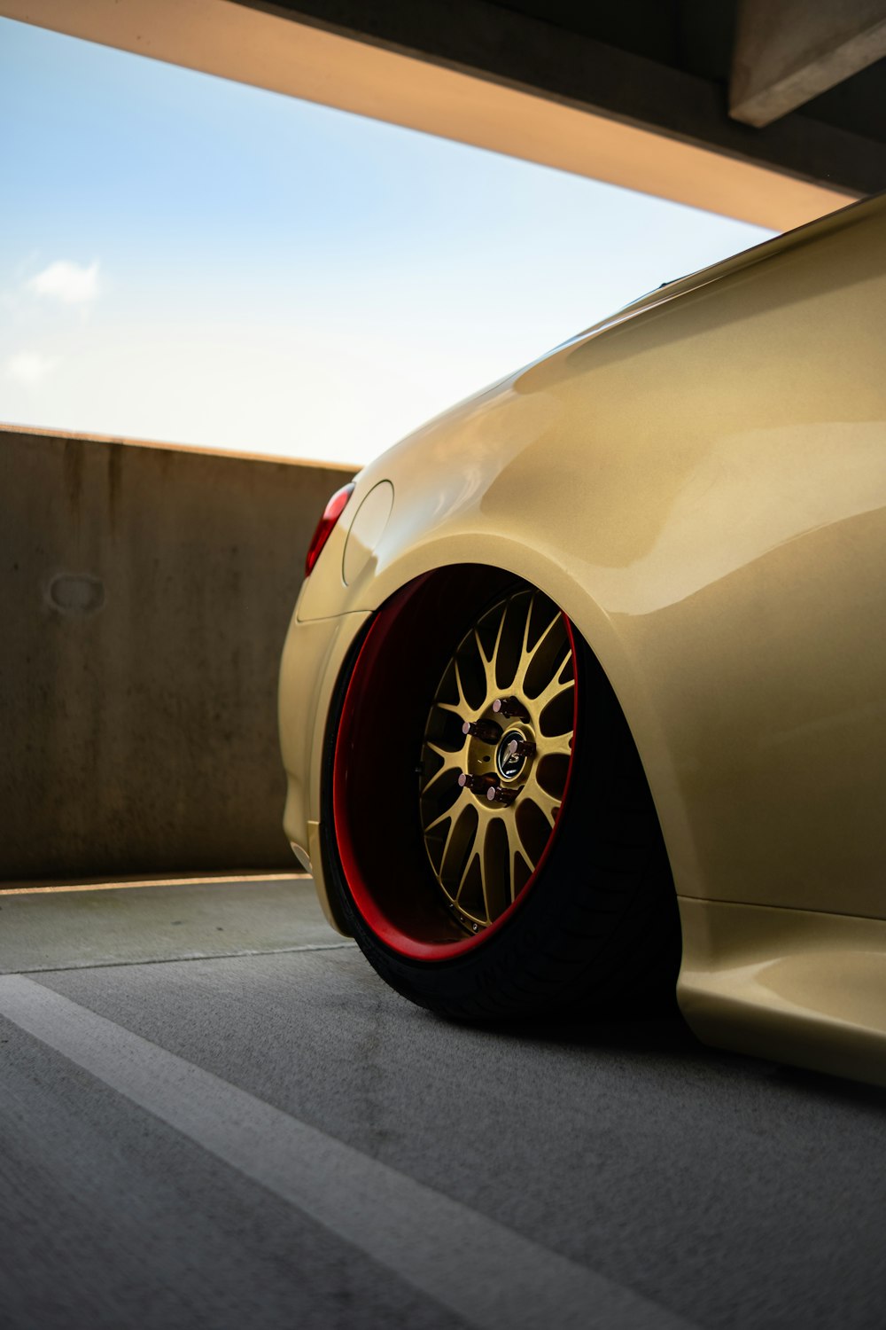 white car parked on gray concrete floor