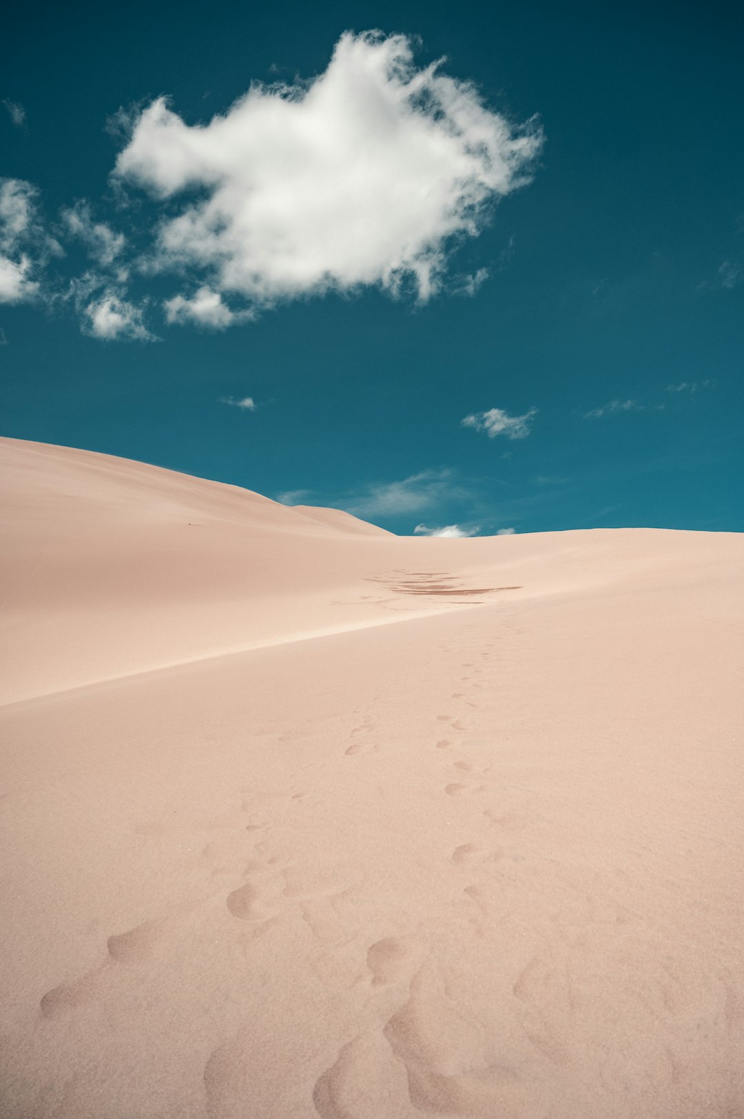 white sand under blue sky during daytime