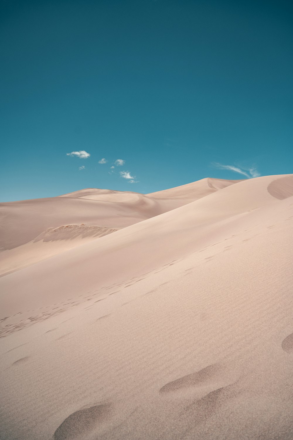 white sand under blue sky during daytime