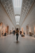 people walking on white hallway
