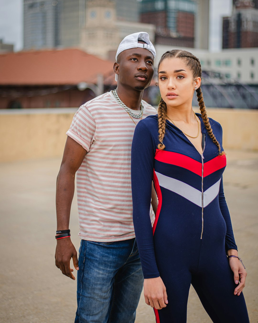 man and woman standing on road during daytime