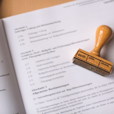 brown wooden hand tool on white printer paper