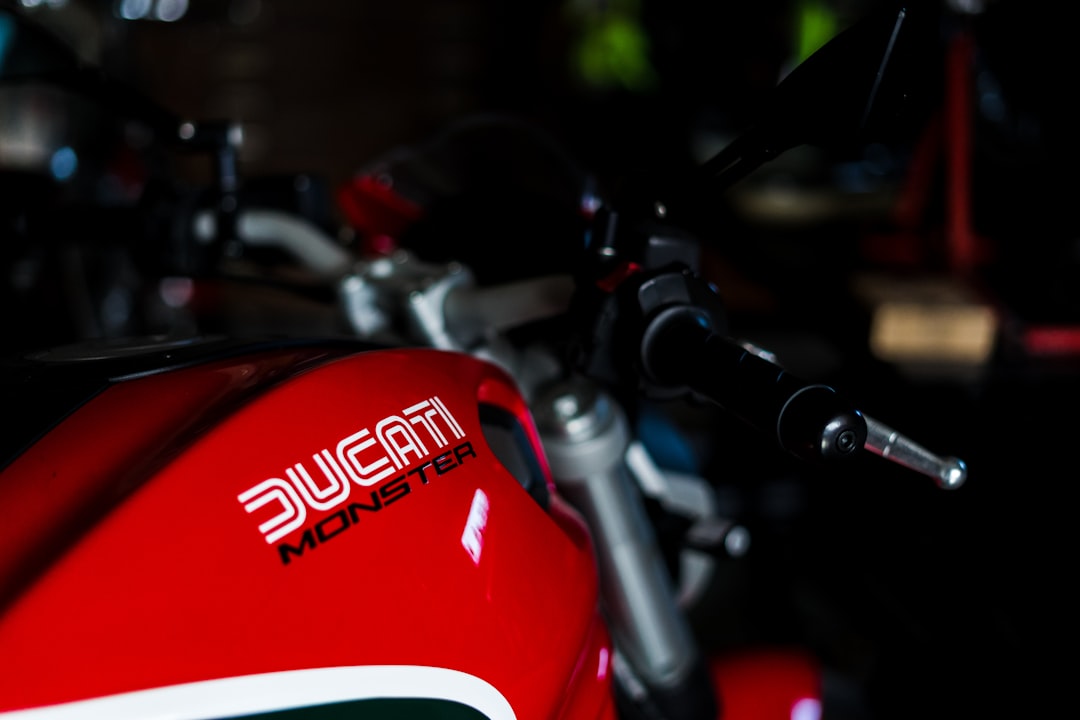 red and white motorcycle in close up photography